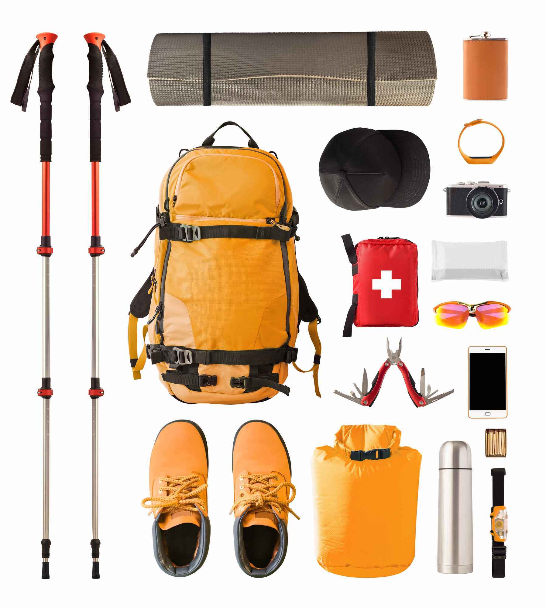 Assorted hiking gear including backpacks, trekking poles, and boots.